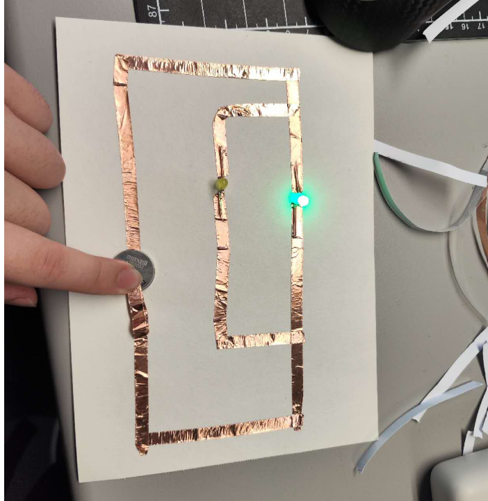 This is me trying to connect a series circuit. I've got one of the bulbs' electrodes installed in the wrong direction. I'm testing it.