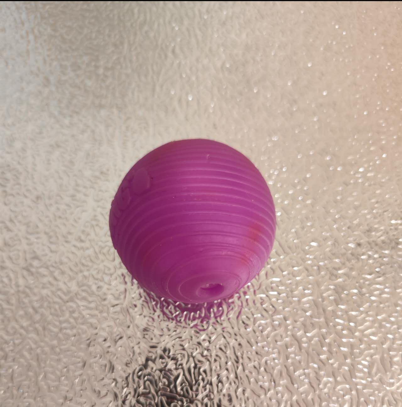 This is a ball for dogs to play with. I took it and photographed it. It can clearly be recognized as a sphere and is convenient to carry.